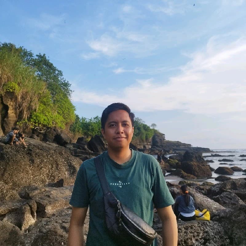 Suastika Adinata at a coastal landscape